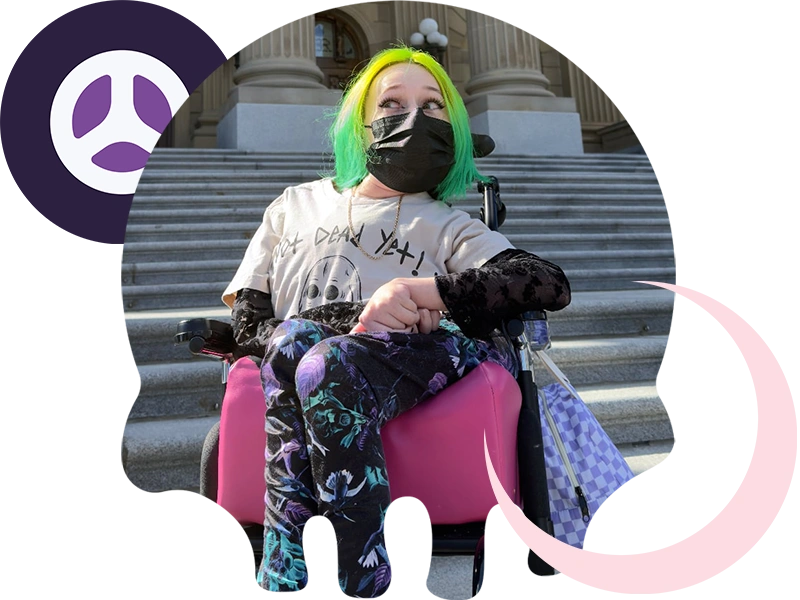 Karli Drew in a mask outside, clipped in a skull shape with a moon and tire graphics.